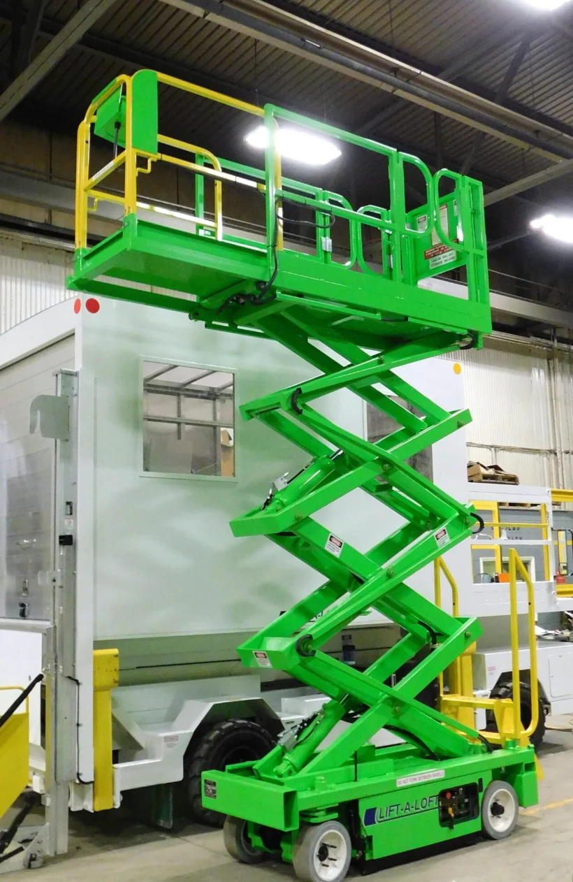 Scissor lift used for overhead warehouse cleaning